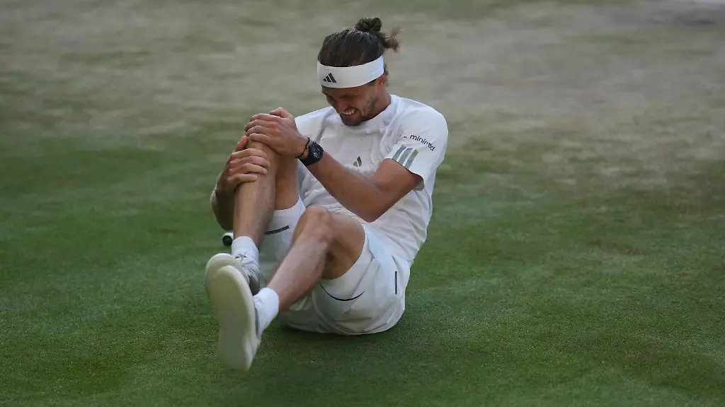 Alexander-Zverev-of-Germany-reacts-after-falling-over-during-a-point-against-Jannik-Sinner-of-Italy-in-the-men-s-singles-final-at-Wimbledon-Tennis-Championships-in-London-Sunday-July-12-2026